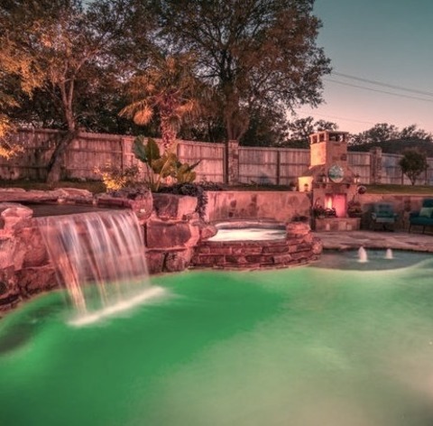 Tropical Pool - NaturalLarge Custom-shaped Natural Pool Idea For A Tropical Backyard With Decking