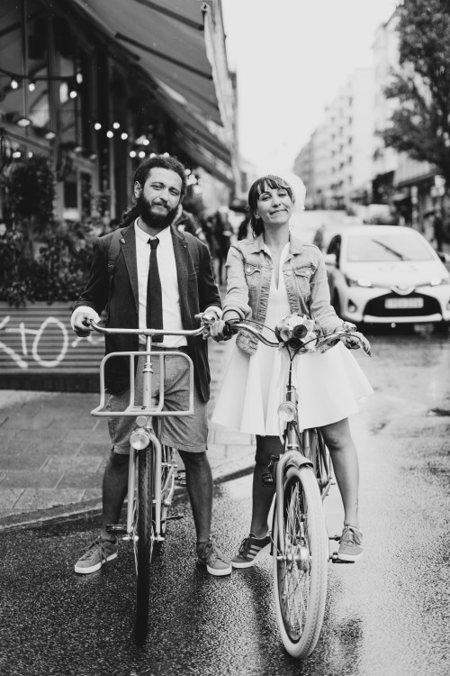 These two lovebirds, just married, riding bikes in the rain :)For the full elopement photo story, cl