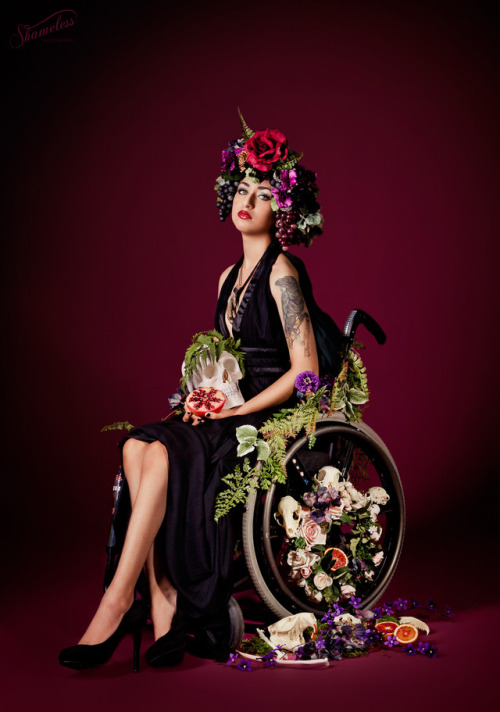 qcrip: L E G E N D A R Y Photos by Carey Lynne Fruth and Sophie Spinelle of Shameless Photography ( he / him or they / them please ) Instagram: pansystbattie [image desc: 5 images of me, a nonbinary indian wheelchair user wearing a flower headdress, claw