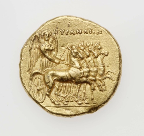 Gold stater of Cyrene, struck under Polianthes, with Nike driving quadriga (obverse) and Zeus Ammon 