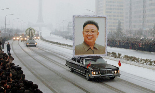 Car carrying a portrait of Kim Jong-Il during the funeral procession in Pyongyang. Kim Jong-il serve