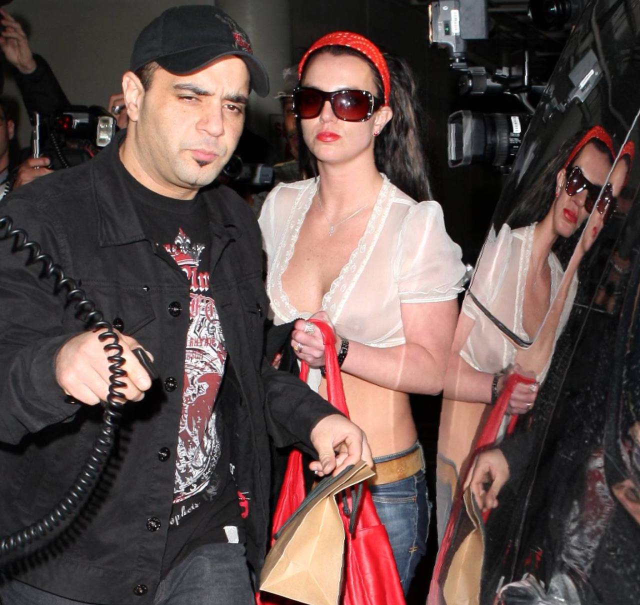 boa-celeb:  Britney Spears - See-Through Braless White Top Candids