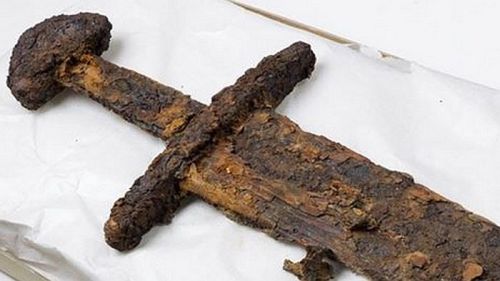 art-of-swords:  [ NEWS ] The discovery of this 10th-century Viking sword in Norway led to a major surpriseLast year, the discovery of an ax head on a mountaintop overlooking Norway’s Trondheim Fjord led archaeologists to a tenth-century Viking grave.