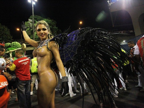 Porn photo Topless woman at Brazilian carnival.