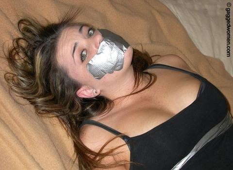 A fresh face gagged with some fresh tape.