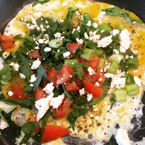 Greek scrambled eggs Fresh garlic, parsley, mint, green onion and oregano tossed with tomato and fe