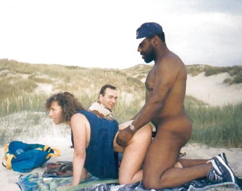 doublefeel:This bull was jerking his cock when we arrived to the beach and he made my wife so hot that she started to lick her lips while watching his cock. He came to her, grabbed her doggy style and I said: “Honey, but you started to fuck him before