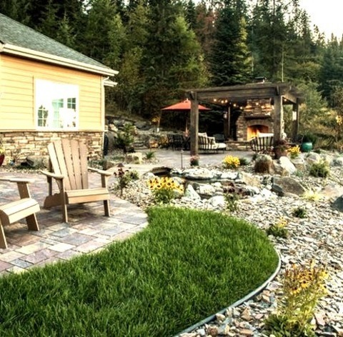 Photo Of A Medium-sized, Rustic Front Yard With A Concrete Paver Water Feature.