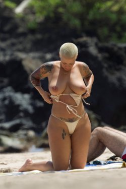 jezebelrising:  celebritiesofcolor:Amber Rose goes topless on a Maui beach Wiz Khalifa musta been hung like a horse and had some mad oral skillz, cause that’s the only way I see him nabbing this woman.