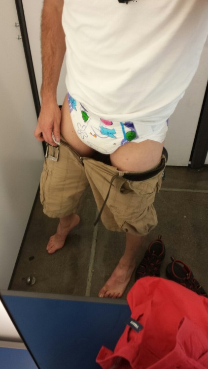 codydl88:  Shopping day. Salmon shorts! Yay!  Codydl88 is too damn cute! Sadly he only wets his pants while diapered, but I had to share his diapered dressing room pics because he is one very handsome diaper man. 