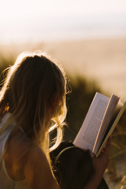 This is my ideal reading situation.  Outside…in morning or evening warm light, on the dunes or in a field just soaking up the warmth as I read myself into some other existence. 