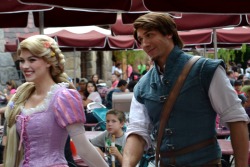 finallygotalife:  humanslookingatthings:  Flynn Rider admires Rapunzel with love while a young boy with a churro stares in disdain at Disneyland  One day you will find love too, Churro Boy. 