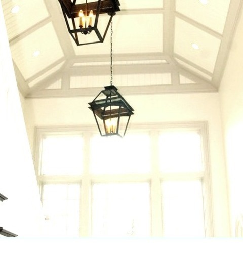 Foyer MudroomInspiration For A Large Timeless Dark Wood Floor, Vaulted Ceiling And Wall Paneling Entryway
