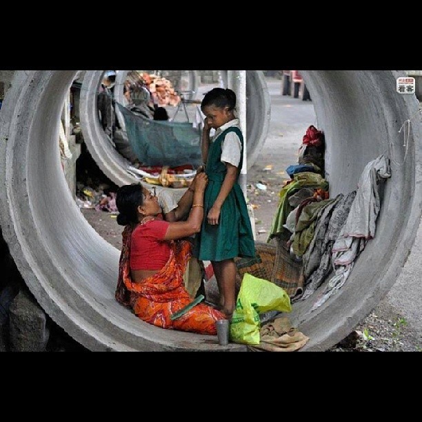 pmodad:  the value of education.a mother preparing her daughter for school despite