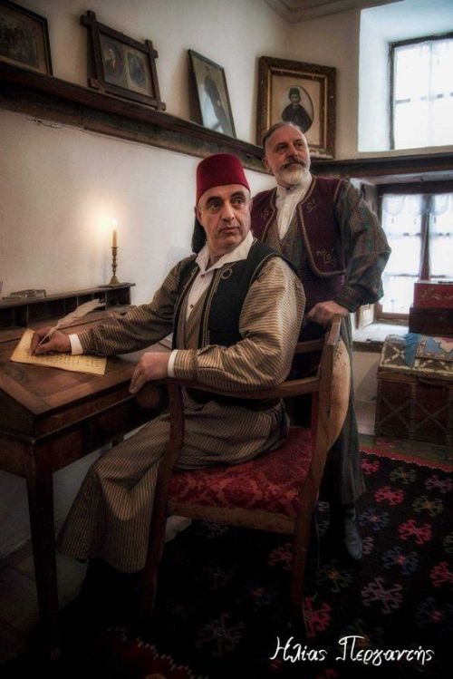 Scenes from the past. Greeks dressed in traditional attire in the Folklore Museum of Kastoria, house