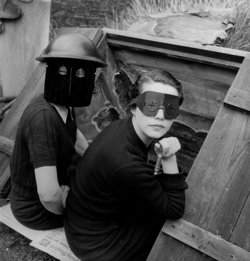 endlessreveries:Lee Miller, Women in fire masks, Downshire Hill, Hampstead, London, 1941.