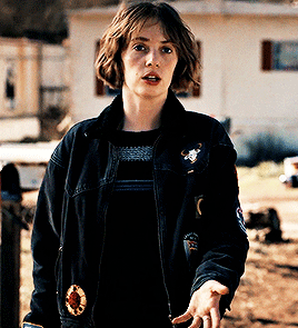 Queer In A Denim Jacket With Patches And Pins