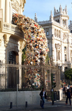 sixpenceee:  Madrid-based artist Alicia Martin transforms thousands of disused books into tumultuous towers that pour out of windows and into the streets. 