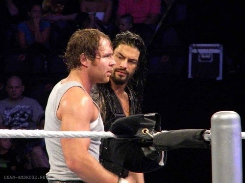 kweenturtle:  Reigns is looking at Ambrose like every fan girl wants to.. Yummy.