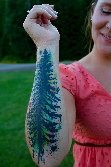 fuckyeahtattoos:  Douglas Fir tree with watercolor brush strokes and paint splatters. This tattoo was done by Maki at Skeleton Key Tattoo on Hawthorne Blvd in Portland OR