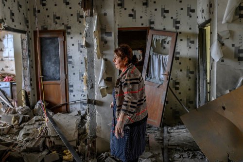 Xatire Celilova in her destroyed apartment following a ceasefire between Armenia and Azerbaijan, in 