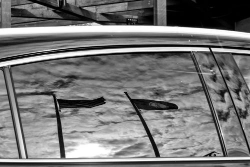 Day 132 of 365 - Flags in Reflection  #reflection #flags #clouds #bnw #bnwphotography #blackandwhite