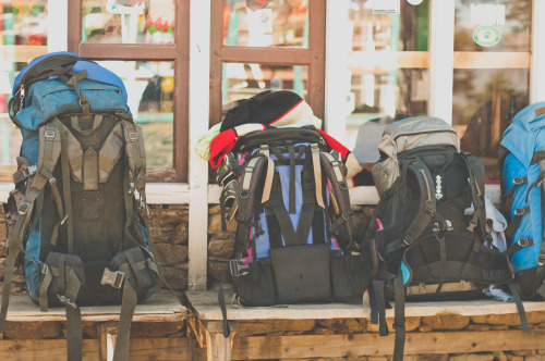 Packs off for a food and chiya stop at Cholangpaty, Rasuwa, Nepal.  Photography by BrookR