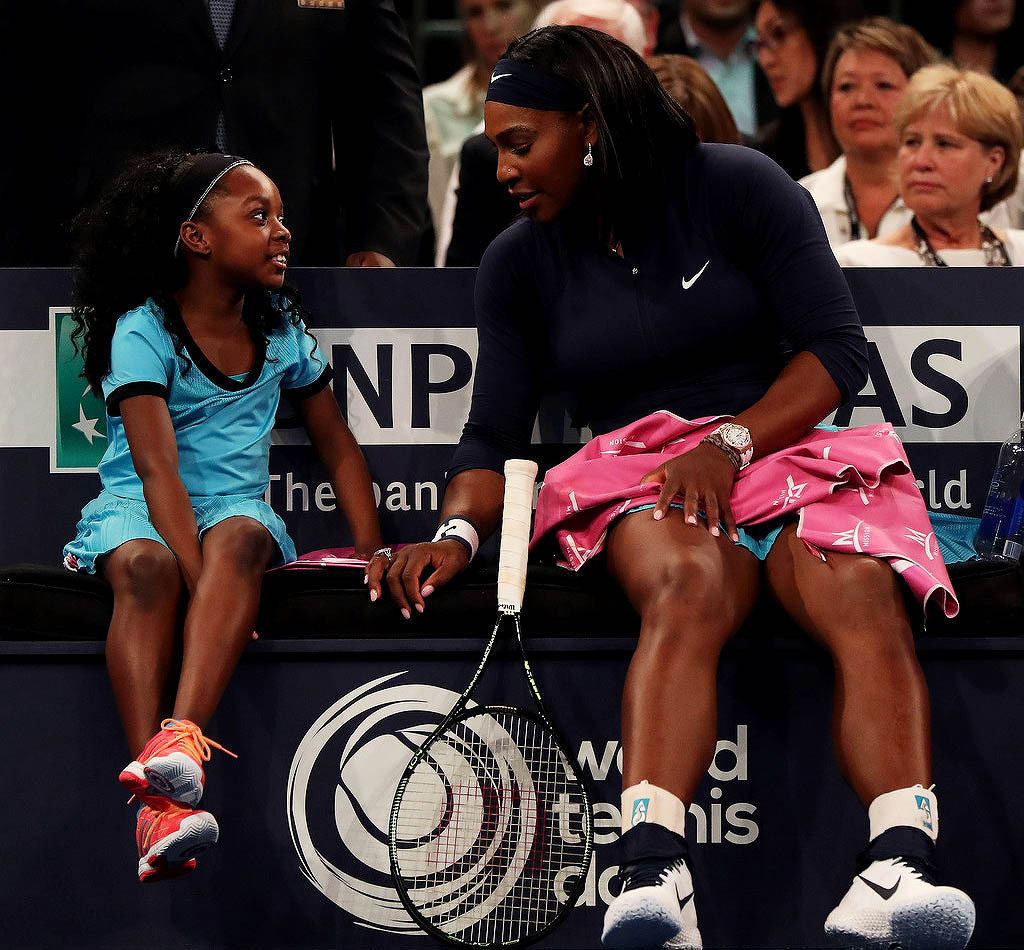 soph-okonedo:    Serena Williams speaks to a young fan on the bench as she plays