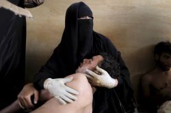 criwes:  Samuel Aranda - A Woman Protects Her Son “Fatima went looking for her son amid the violence in Yemen. This is the moment she found him alive.” 