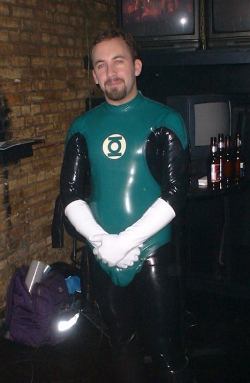 2manykinks:  rubbergloved:  The Green Lantern latex costume made by Chris may british designer  Reddy is SO cute as a rubber GL … tho I really wanted to see him get worked over by a villain.  ;)  Still, can’t beat white rubber gloves for maximum