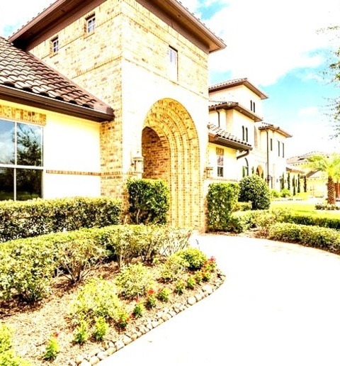 Tile Houston Large Tuscan Beige Two-story Mixed Siding House Exterior Photo With A Hip Roof And A Tile
