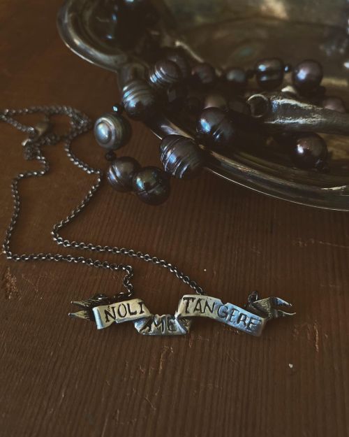 Touch me not- Tattered from overuse, a banner to remember your mantra . . Sterling silver and weath