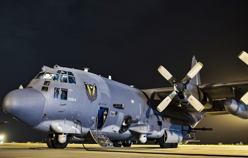 AC-130U Spooky and CV-22 Osprey A U.S. Air Force AC-130U Spooky Gunship from the 4th Special Operat