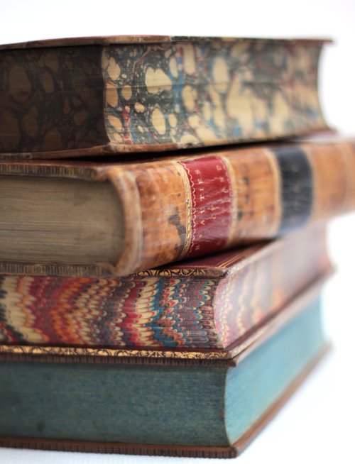 tashialfonso:michaelmoonsbookshop:antique leather bound books from the 19th century with marbled and