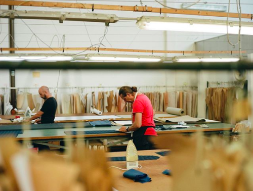 Mirko cutting patterns for a jacket at Sartoria Carrara, our Italian atelier.