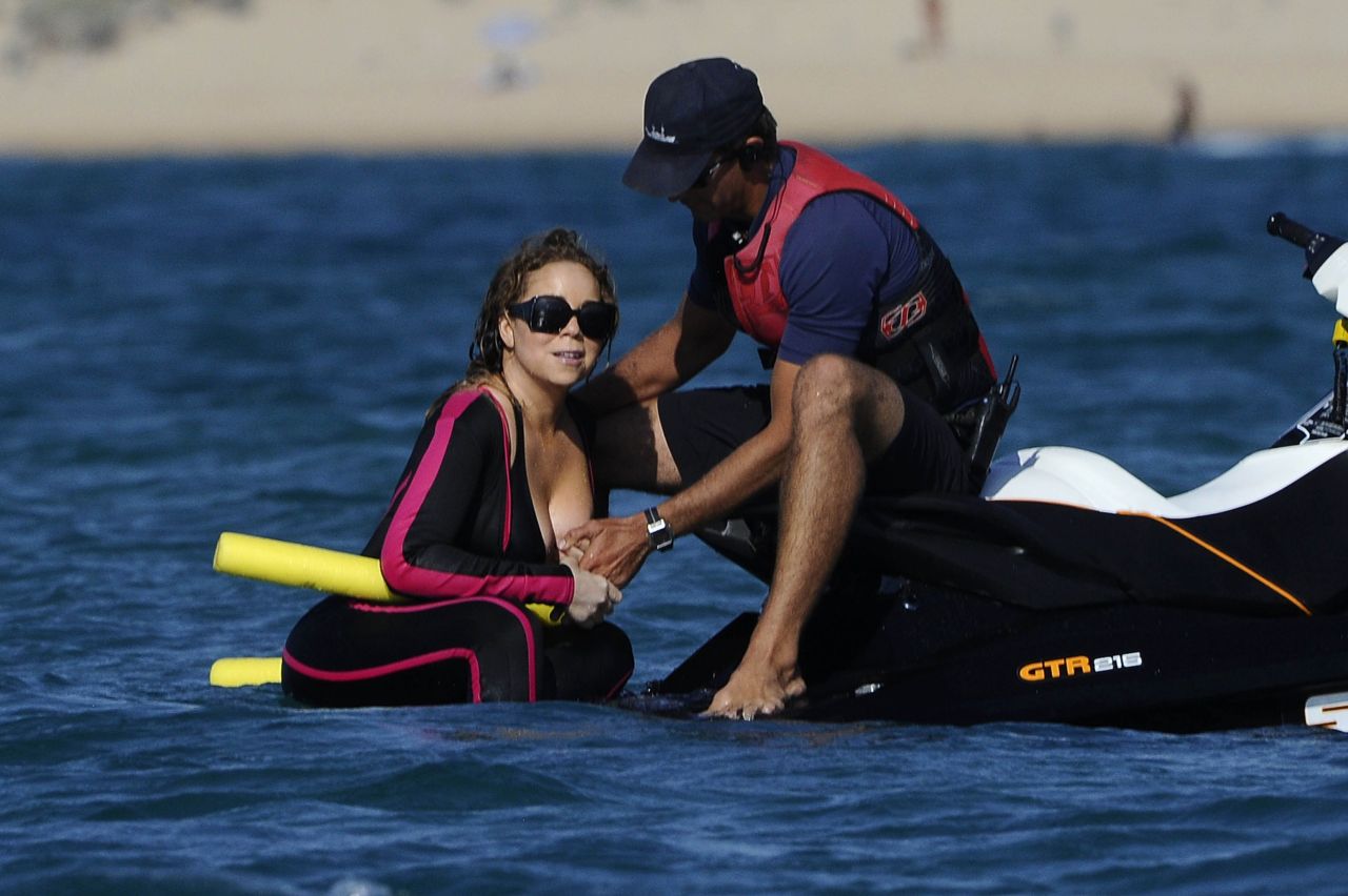 blackfemalecelebrities:    Mariah Carey - Wearing a wetsuit in Italy - 06/21-2015