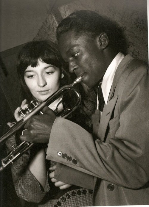 Juliette Gréco and Miles Davis playing the trumpet together at the jazz club Le Tabou, Paris,