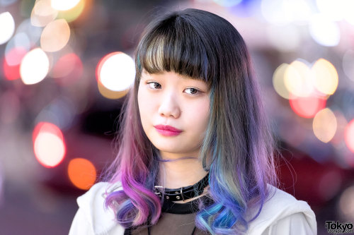 Elleanor on the street in Harajuku wearing a hooded &ldquo;RIOT&rdquo; cape from the Finland