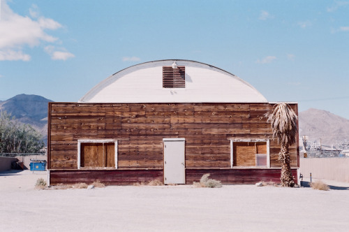 We recently came back from an adventure out west. This is a shot of a road-side hangar/warehouse-turned cabin next to a gas station.