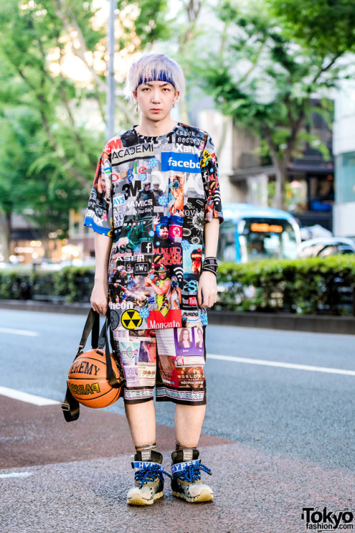 Kenta on the street in Harajuku wearing a DVMVGE logo print top with Samsara Collection graphic shor