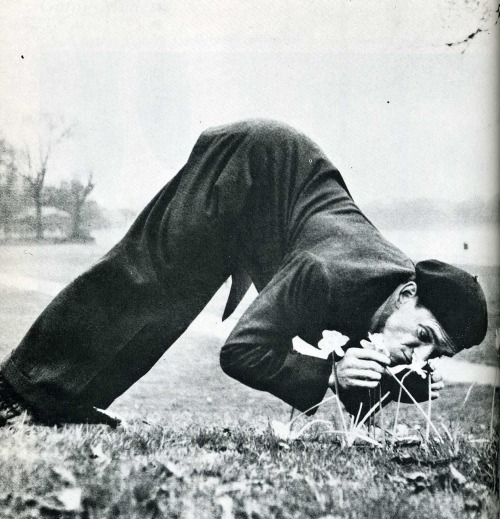 German contortionist Eddy Merky savors the daffodils of London’s Hyde Park.