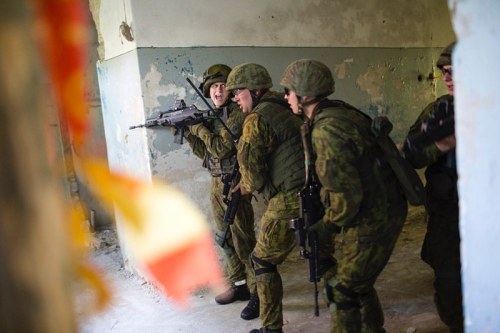 Lithuania, 2016. Lithuanian soldiers training with US army rural fighting in houses. This programm w