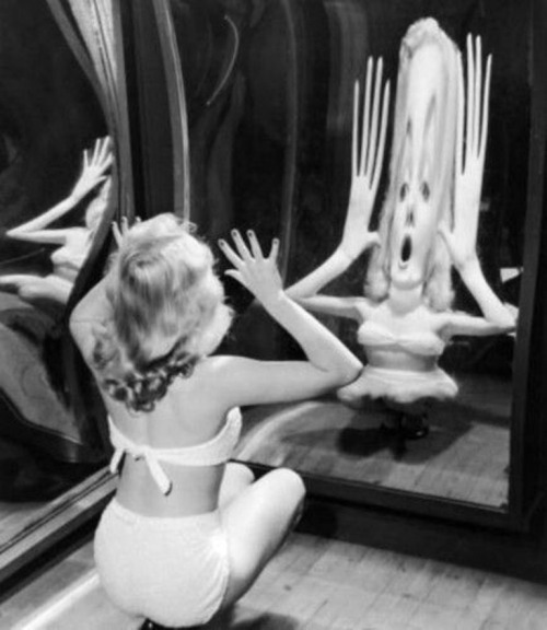 Marilyn Monroe in a fun house mirror, 1950’s.