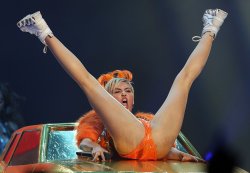pornwhoresandcelebsluts:  Miley Cyrus does more slutty spread leg crotch shots live in concert on the Bangerz tour