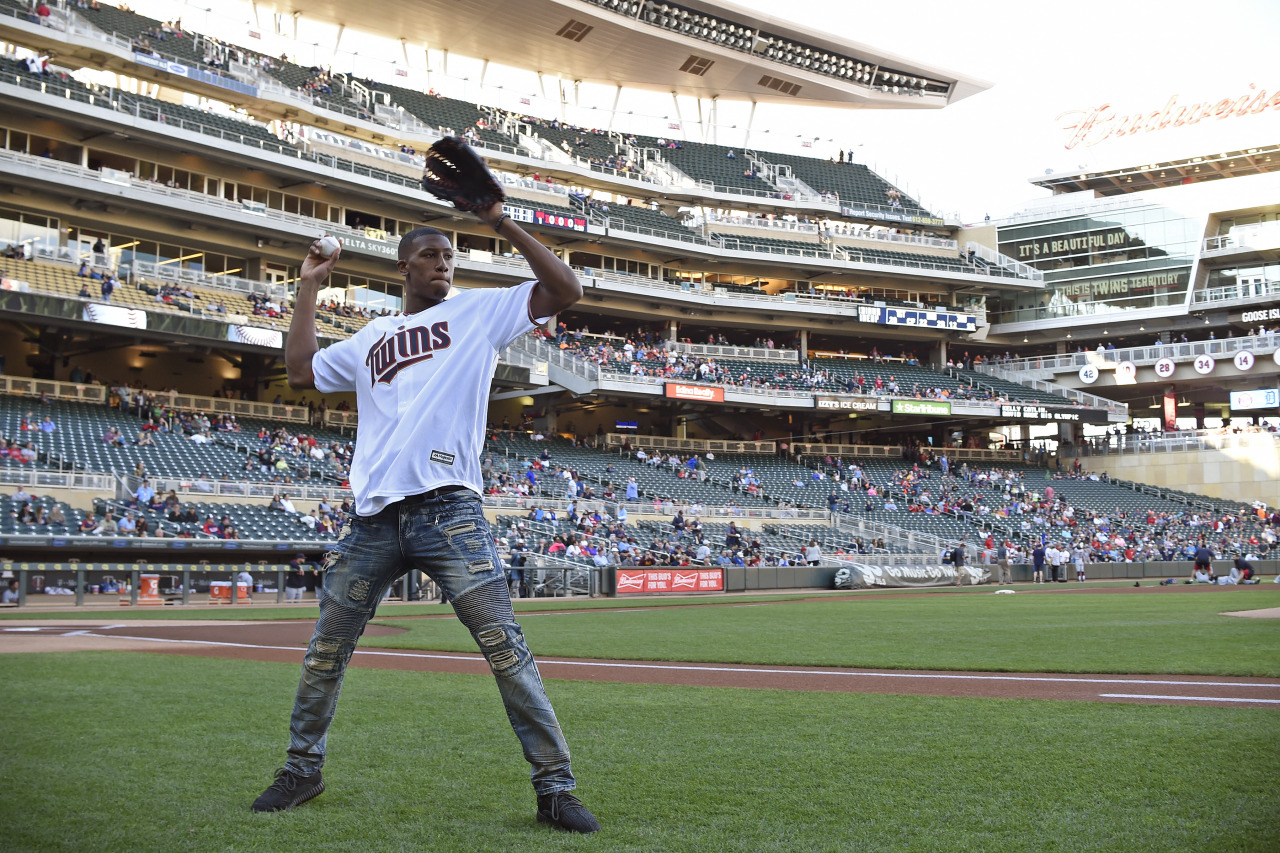 MINNEAPOLIS, MN - SEPTEMBER 11: Kris Dunn #3 of the Minnesota Timberwolves throws out the ceremonial first pitch prior to the Minnesota Twins MLB game against the Cleveland Indians on September 10, 2016 at Target Field in Minneapolis, Minnesota. NOTE...