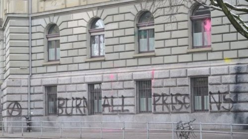 &ldquo;Burn All Prisons!&rdquo; Graffiti and paint-bombs on Bern City Hall in Switzerland, in solida