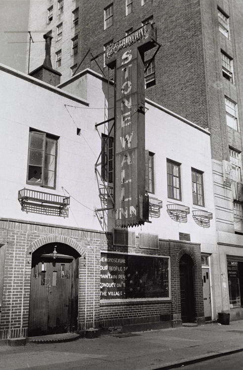 lesbianherstorian:the stonewall inn shortly after the uprising with a sign that reads “we homo