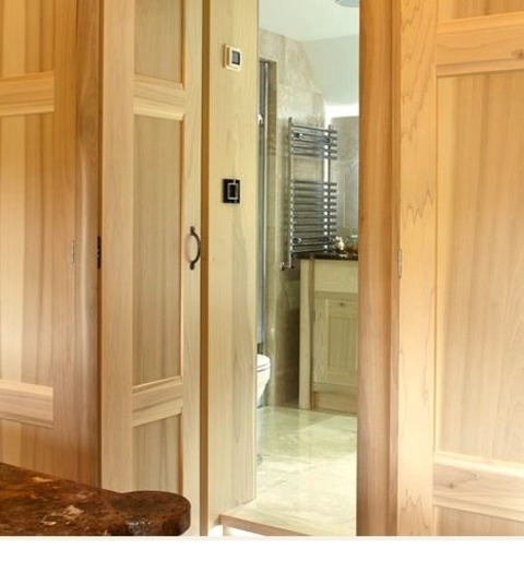 Closet SurreyHuge Minimalist Image Of A Carpeted, Gender-neutral Dressing Room With Recessed-panel Cabinets.