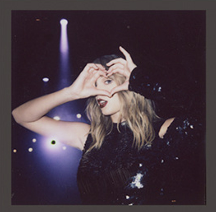 Taylor's hand hearts throughout the eras. —