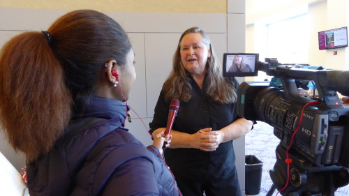 Artist Helen Kelbesadel being interviewed by the student TV station during her visit to SIU with the Exquisite Uterus Project.